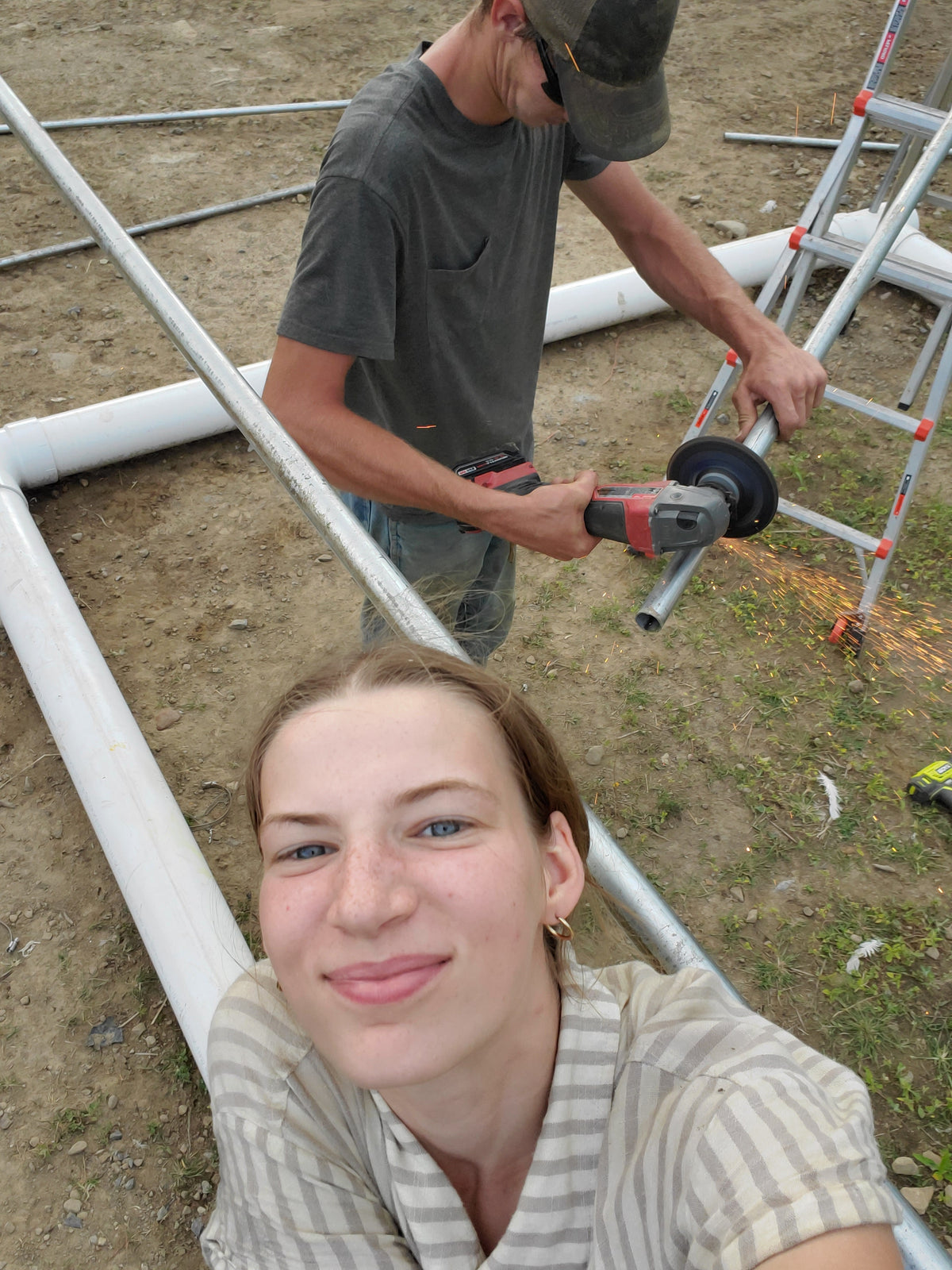 Elisheva and Elisha building a chicken tractor