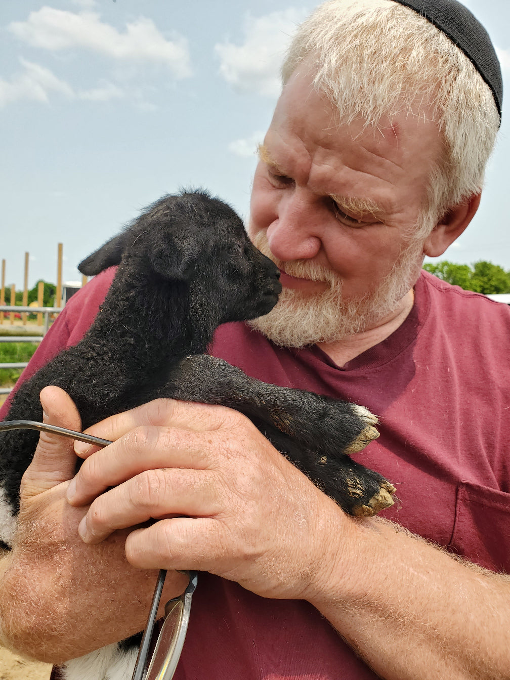 Eric holding a baby lamb